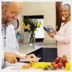 middle aged couple preparing a meal